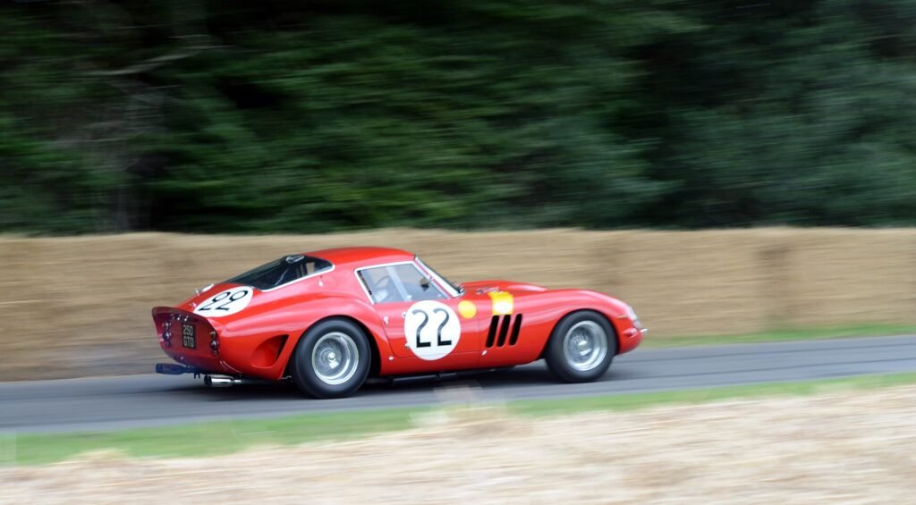 A red 250 GTO on the track