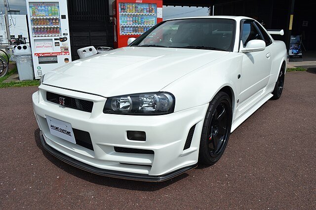 A white Nissan Skyline GT-R V-Spec II Nür (R34) front