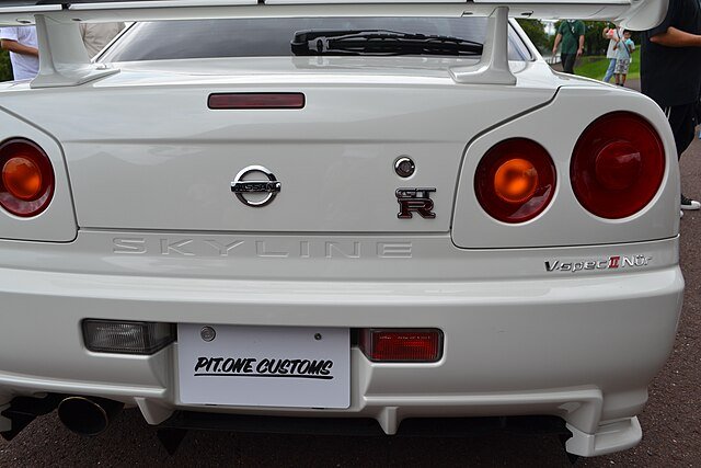 A white Nissan Skyline GT-R V-Spec II Nür (R34) back