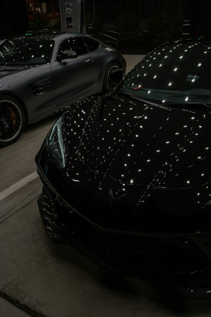 Black corvette under the light
