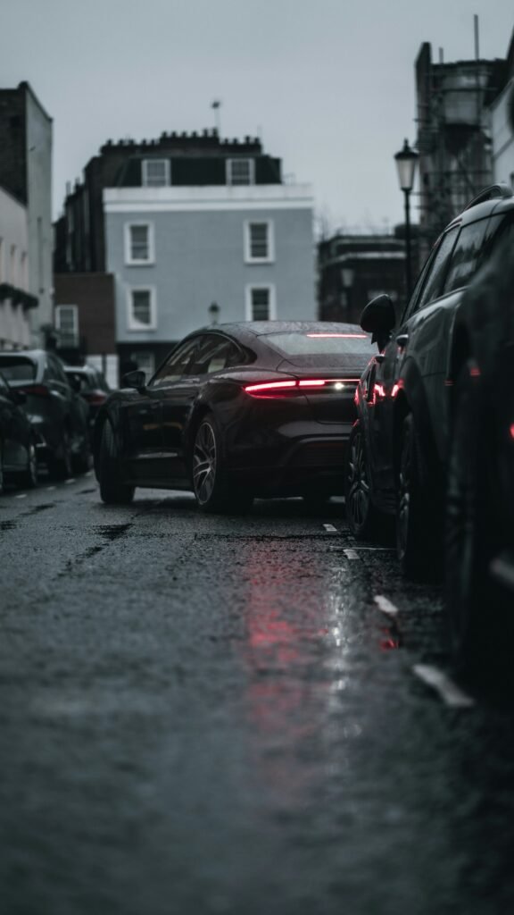 A black porsche reversing